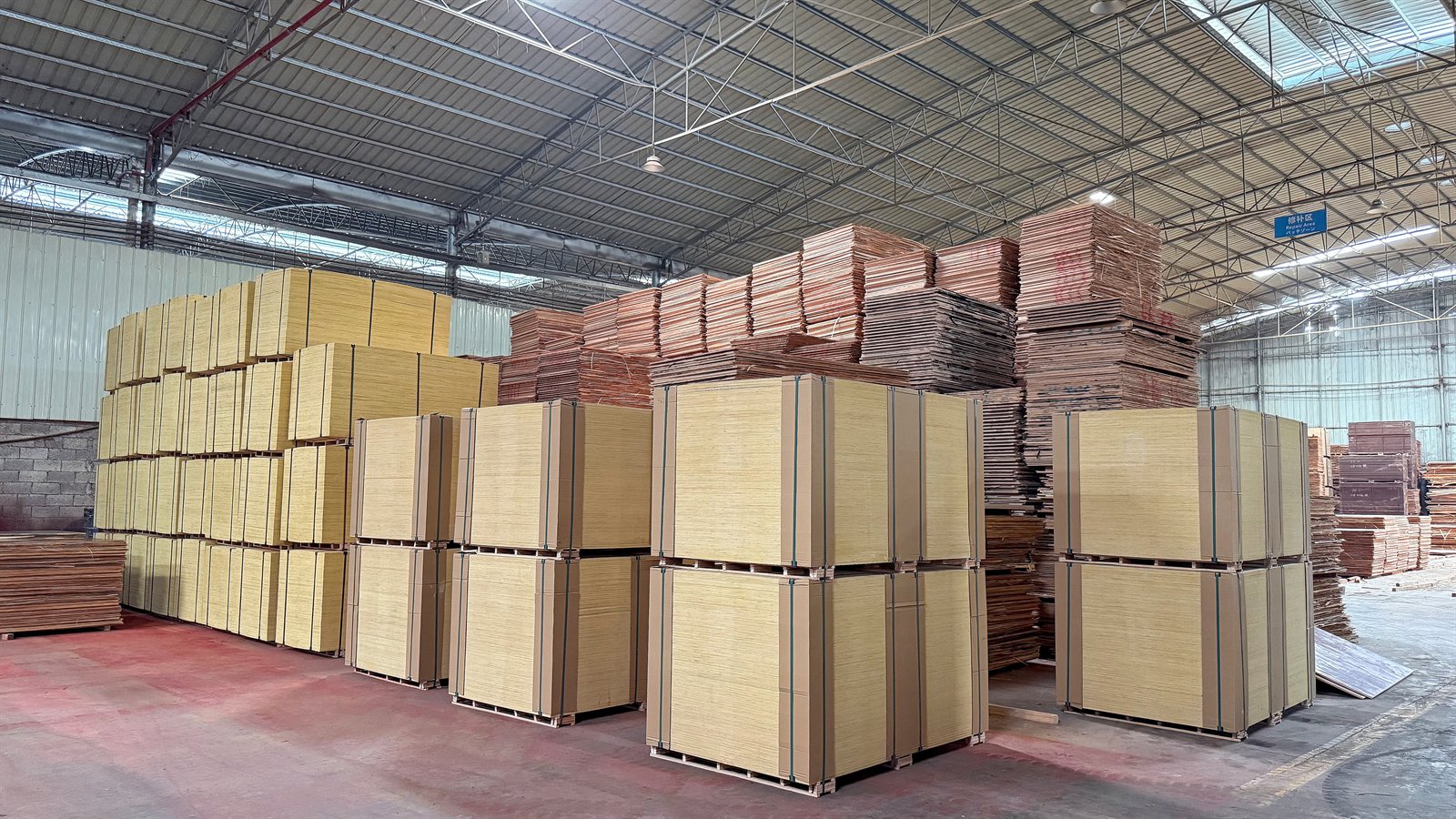 Finished plywood pallets organized in warehouse inventory